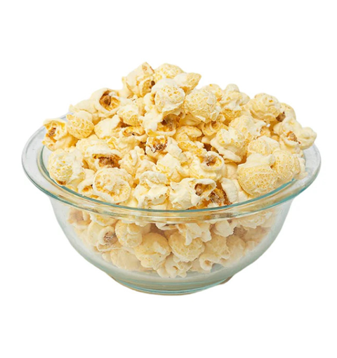 Glass bowl filled with popcorn on a white background